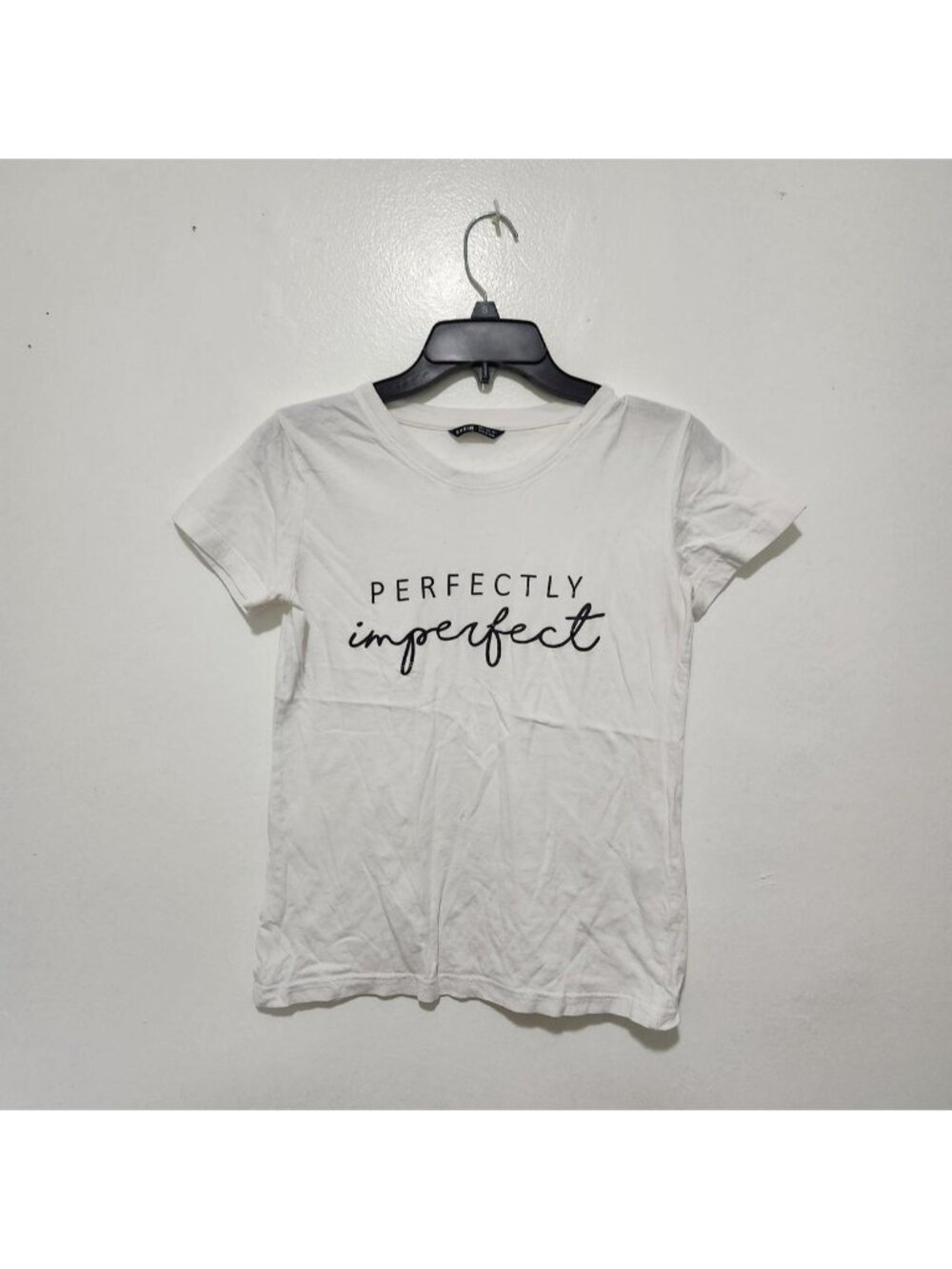 SHEIN white t-shirt with black text reading 'PERFECTLY imperfect'